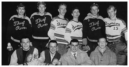 A group of men in hockey uniforms posing for a picture.