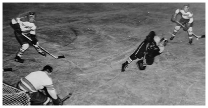 A baseball player is laying on the ground