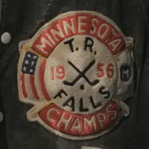 A patch of minnesota champs is shown on the back of a jacket.